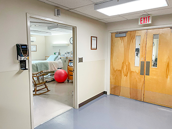 Our labor and delivery suites, with in-room shower, are located in a private hallway.Photo of the Labor and Delivery hallway showing doorway into private Labor and Delivery room.