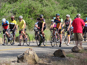 Pictured here: Start of the race at Hammer Creek. 
Below: Leaving Hammer Creek, always uphill.
Photos contributed by Doug CarverBicyclists lined up to start a race
